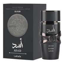 Black Asad Elixir eau de parfum bottle beside matching box