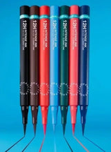 Assorted felt-tip eyeliner pens lined up, with capped pointed tips