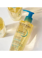 Bioderma Atoderm shower oil bottle with blue pump, angled view
