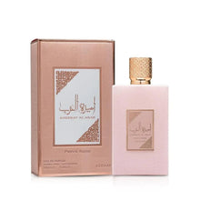 Rose-toned eau de parfum bottle with gold cap and matching product box