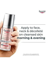 Eucerin serum bottle in hand with directions to apply on face and neck