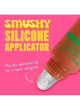 Smushy matte lip balm with silicone applicator tip on clear window base.