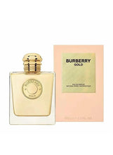 Square eau de parfum bottle with gold cap and matching Burberry Gold box