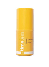 Vitamin C serum bottle with yellow cap, cylindrical glass container, 30 ml