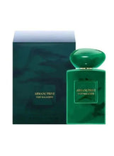Green eau de parfum bottle with Armani/Prive label and matching gift box
