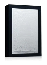 Eau de parfum gift box with embossed white front panel and dark outer cover