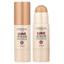 Golden pearl highlighter stick with capped tube and smooth, glossy finish