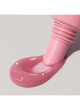 Glossy pink lip tint swatch with thick, gel-like texture
