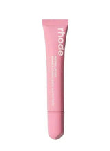 Pink lip tint tube with ribbed cap and glossy applicator