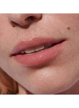 Pink tinted lips with high-shine lip balm finish