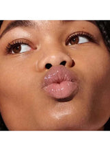 Glossy rosy-pink lips with smooth, reflective shine