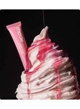 Pink lip tint tube with swirl and drips of berry-colored cream