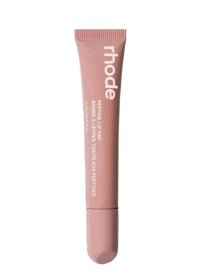 Light brown nude lip tint tube with ribbed applicator