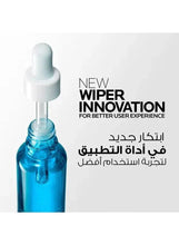 Serum dropper bottle close-up with white dropper stem and blue glass vial