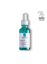Serum bottle with white dropper cap, teal glass and label