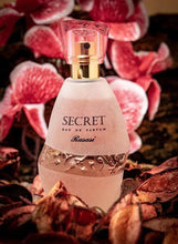 Rasasi Secret Eau de Parfum bottle with gold collar and pink faceted cap