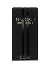 Black perfume box with Gucci Intense Oud branding and 90ml EDP
