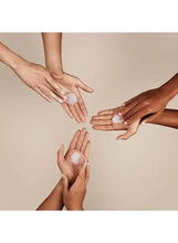 Almond hand and nail care, hands applying light cream to fingertips and palms