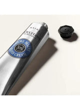 L'OCCITANE hand cream tube close-up with black cap and blue 20% seal