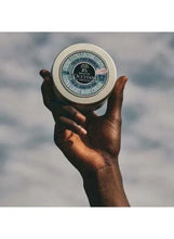 L’Occitane body cream jar held up in hands, 175 ml