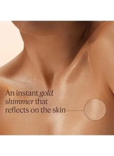 Gold shimmering body oil on skin, radiant glow with visible shimmer