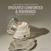 Open ultra-rich face cream jar with silver lid and creamy product inside.