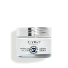 Ultra-rich face cream jar with silver lid and white label.