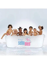Sebamed baby protective facial cream branding on tub with children in front