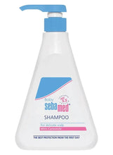Baby shampoo bottle with blue pump, white bottle, chamomile scalp care