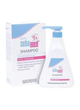 Baby shampoo box and bottle, blue label accents on white container