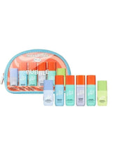 Mini trial skincare set in turquoise zip pouch with colorful mini lotion bottles