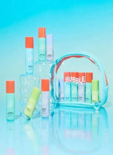 Skincare trial kit with turquoise zip pouch and assorted mini bottles in front