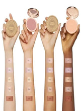 Assorted highlighter compacts with on-skin stripes in different shades