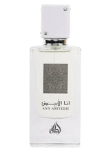 Eau de parfum bottle, clear glass with patterned label and white square cap
