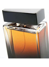 Men's eau de parfum bottle close-up with amber liquid and chrome dispenser rim