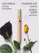 GUCCI hydrating concealer with floral tube, shown with black rose and hyaluronic