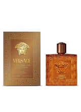 Men's amber perfume bottle and matching gold-patterned box with Versace logo