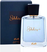 Eau de parfum bottle with dark cap and gold logo on blue-tinted glass