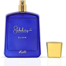 Blue eau de parfum bottle with gold spray cap, shown with extra cap piece