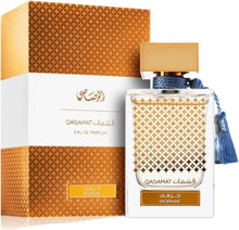Eau de parfum bottle with patterned box, gold cap and blue tassel