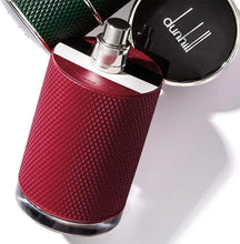 Red textured eau de parfum bottle with open cap and silver spray nozzle