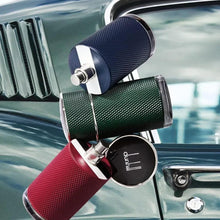 Red and green textured eau de parfum bottles with black circular lids