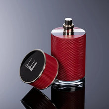 Red textured eau de parfum bottle with silver spray cap and black lid