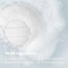 White round bath bomb with visible speckled texture on surface