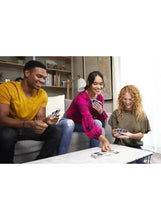 Family card game night with people holding and playing playing cards at a table