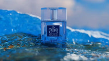Zimaya Mazaaj infused eau de parfum bottle with blue liquid, splash droplets.