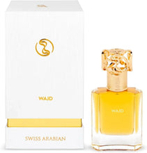 Amber eau de parfum bottle with gold cap next to white gift box