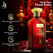 Eau de parfum bottle with dark red glass, gold cap, and floral fruity text