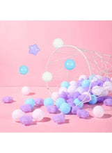Ball and star baby chew pool pieces in light blue and white with purple accents