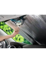 Installed car windshield sunshade pad, silver reflective fabric with black border